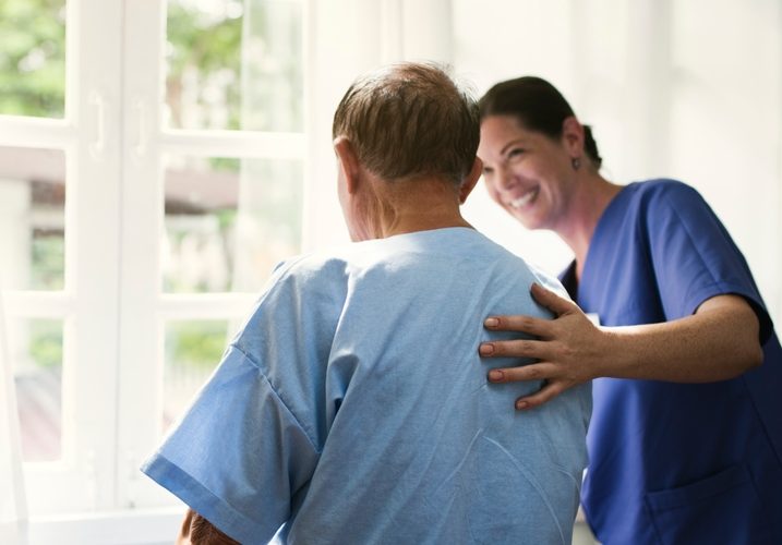 Healthcare professional assisting a patient